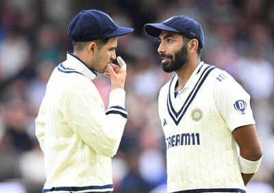 Jasprit Bumrah with Shubman Gill during a match.